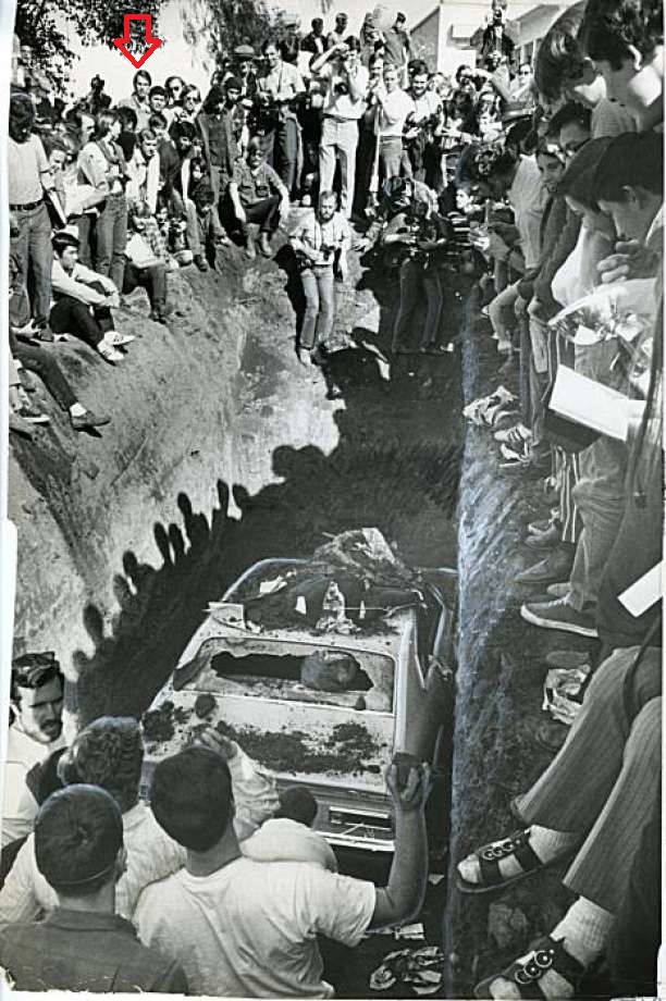 Burial of car at Survival Faire at San Jose State College 2/20/1970