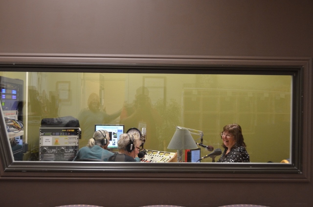 Elaine B Holtz interviewing Julie Combs with Ken Norton at the soundboard in Radio KBBF's new studio